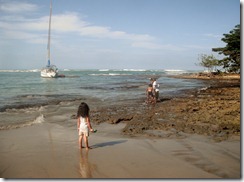 Kids playing and sailboat